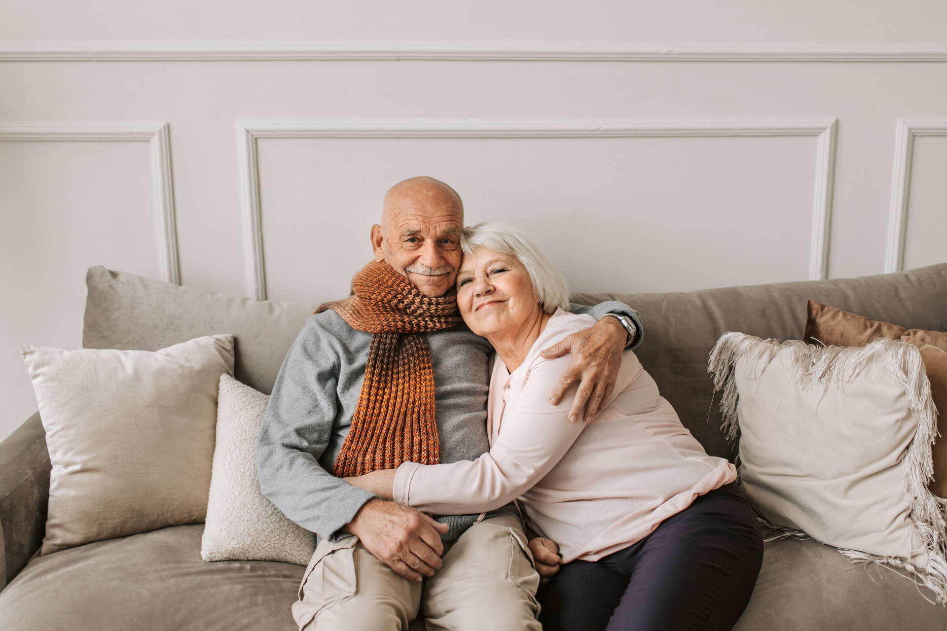 Senior couple relaxing together at home after a thoughtful transition